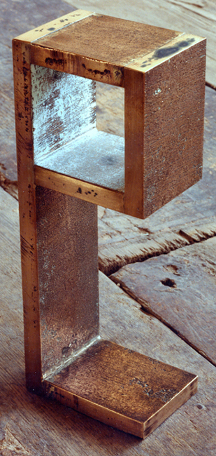 Image of a cast bronze sculpture from the artists psyche of the square series.